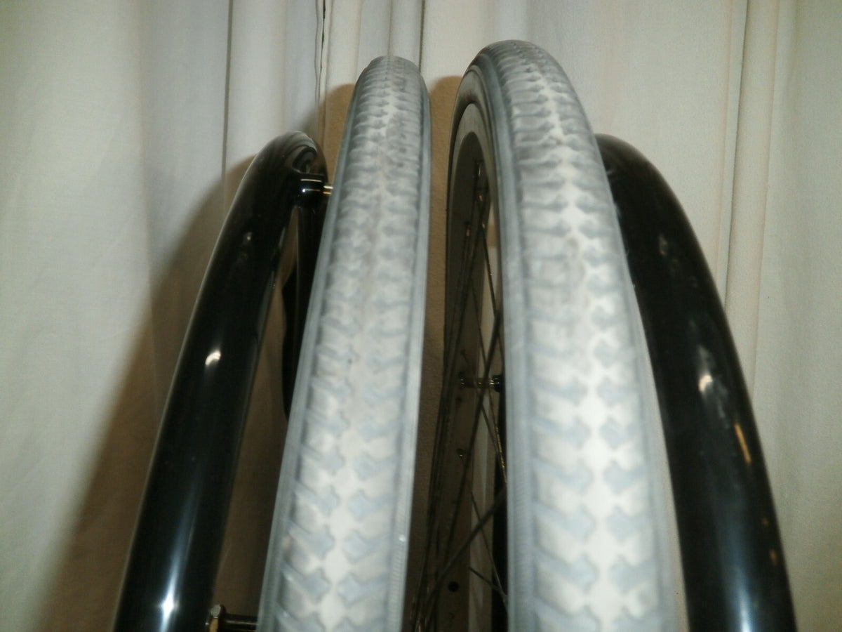 SET OF 2 WHEELS FROM VOYAGE 24" SOLID WITH AXLE VERY GOOD CONDITION
