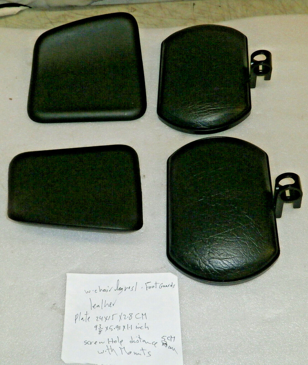 SET OF WHEELCHAIR LEG REST,FOOT GAURDS-LEATHER NEW CONDITION WITH MOUNT PLATES