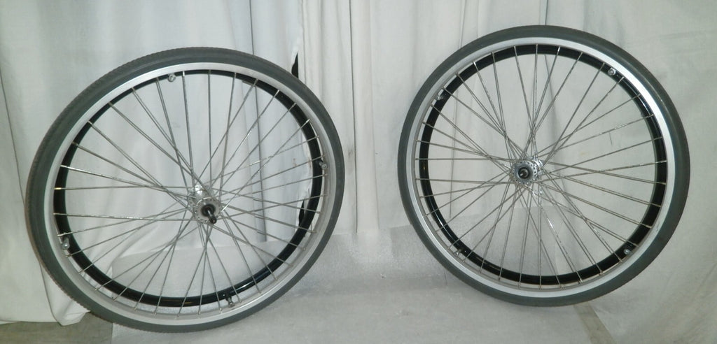 SET OF 2 WHEELS FROM VOYAGE 24" SOLID WITH AXLE VERY GOOD CONDITION