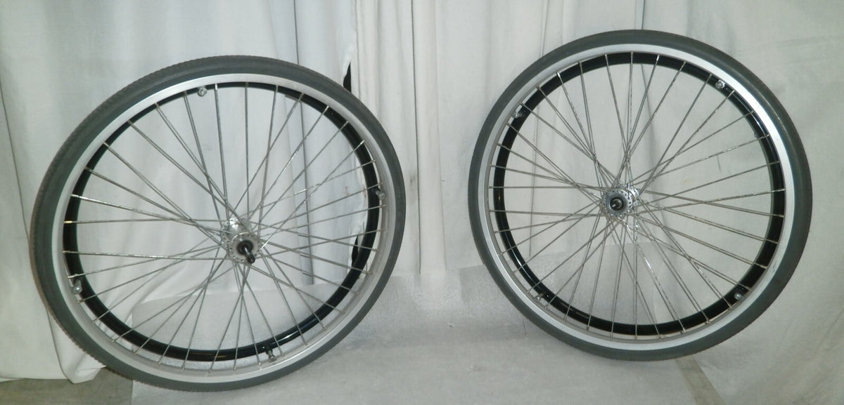 SET OF 2 WHEELS FROM VOYAGE 24" SOLID WITH AXLE VERY GOOD CONDITION